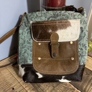 Myra bag with sage green print and cow print. Used 1 time. Excellent condition.
